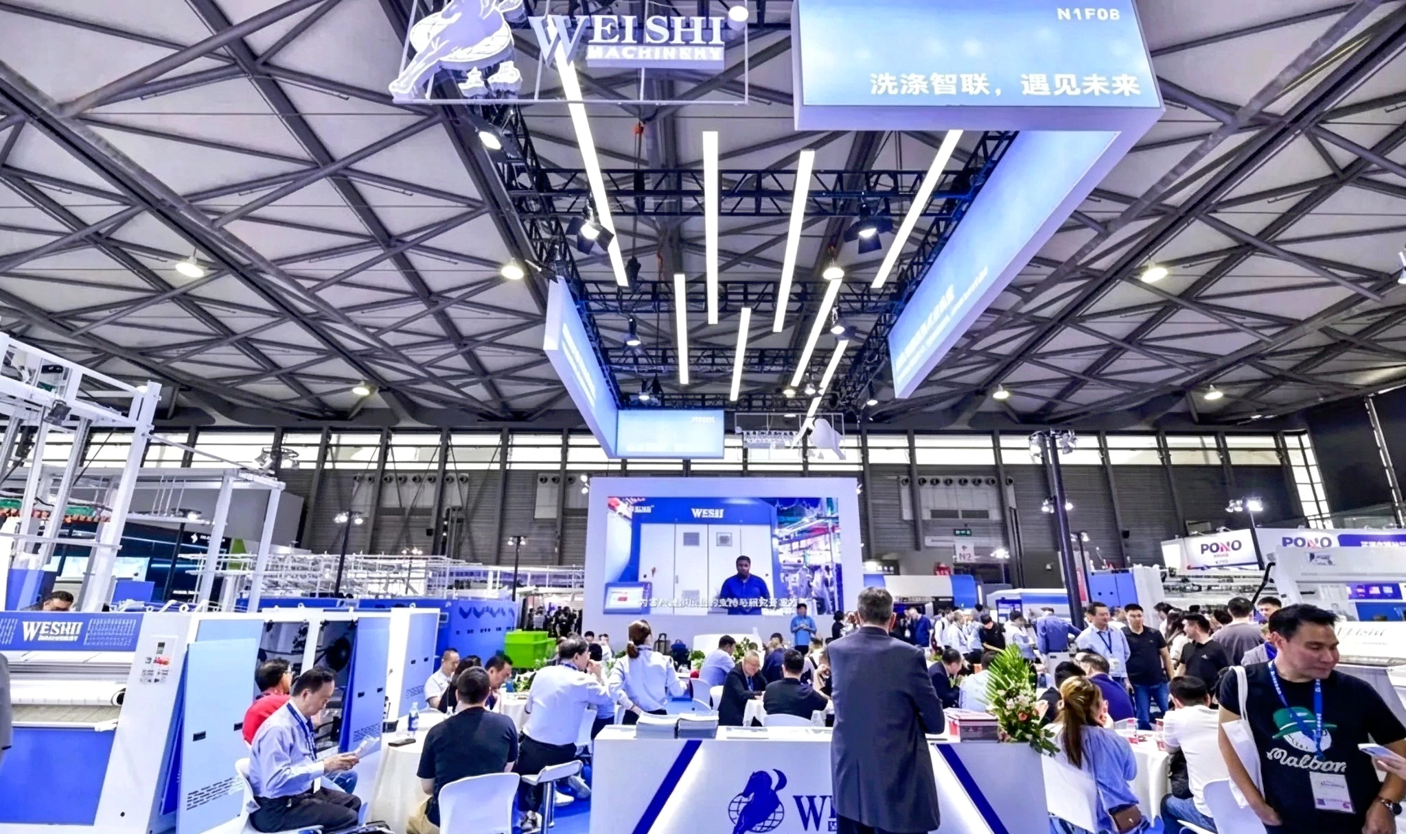 WEISHI booth at Shanghai Laundry Expo, industrial laundry automated production line exhibition